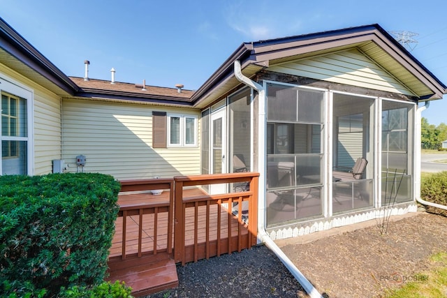 exterior space featuring a deck and a sunroom