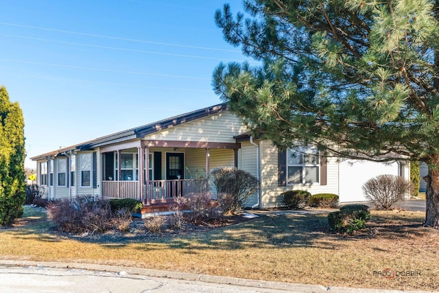 view of front of home featuring a front yard and a porch