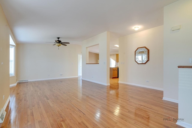 unfurnished living room featuring ceiling fan and light hardwood / wood-style flooring