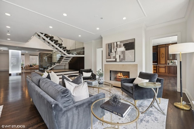 living room featuring ornamental molding and dark hardwood / wood-style floors