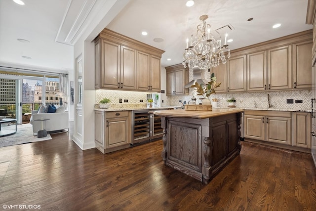 kitchen with wine cooler, a kitchen island, dark hardwood / wood-style flooring, and hanging light fixtures