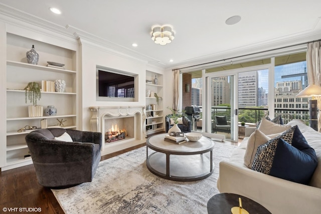 living room with ornamental molding, built in features, and dark hardwood / wood-style floors