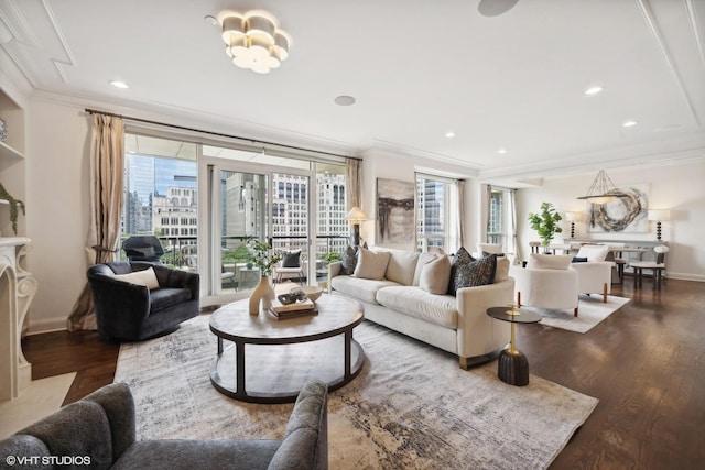living room featuring hardwood / wood-style flooring, ornamental molding, and a high end fireplace