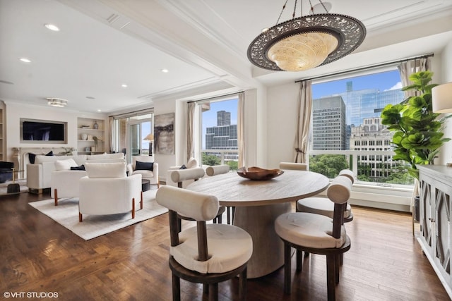 dining room featuring crown molding and built in features