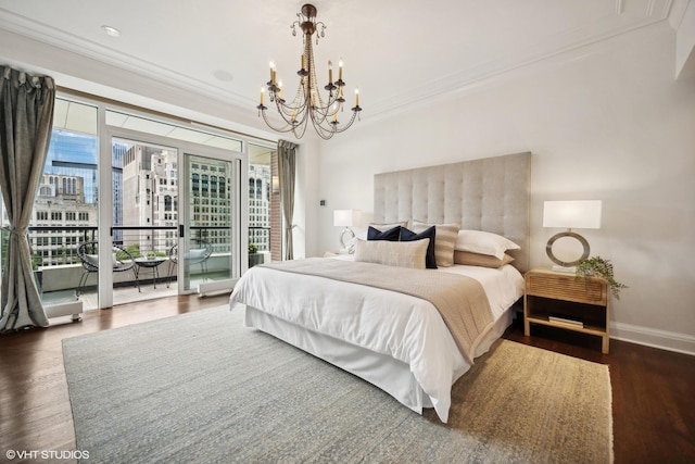 bedroom with dark hardwood / wood-style flooring, access to exterior, a notable chandelier, and ornamental molding
