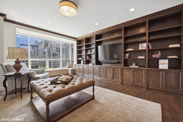 living room featuring dark hardwood / wood-style flooring and ornamental molding