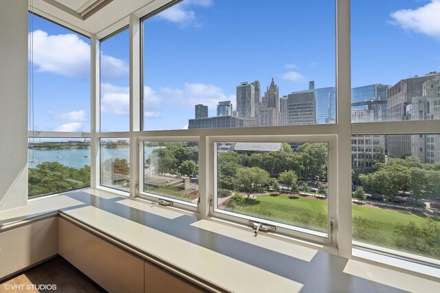 unfurnished sunroom with a water view