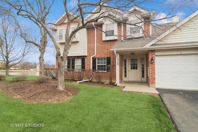 view of front of home with a garage and a front yard