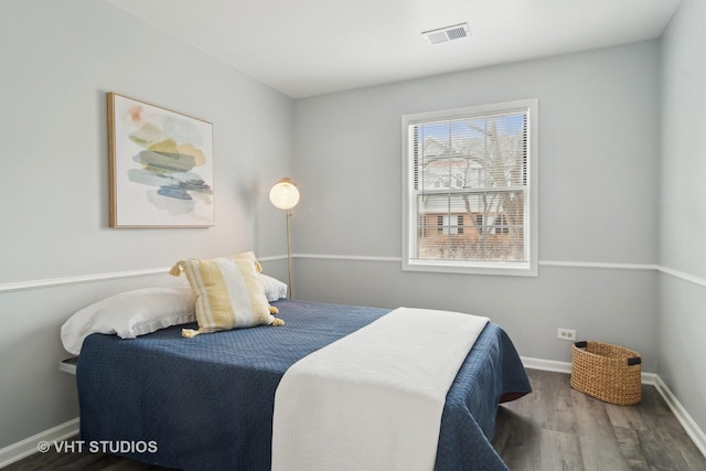 bedroom featuring wood-type flooring