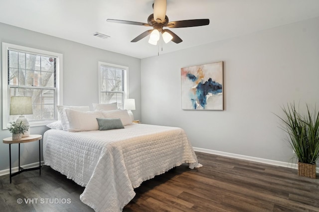 bedroom with dark wood-type flooring and ceiling fan