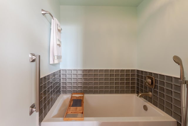 bathroom featuring a tub to relax in