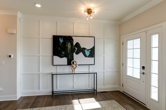 interior space featuring crown molding and dark hardwood / wood-style floors