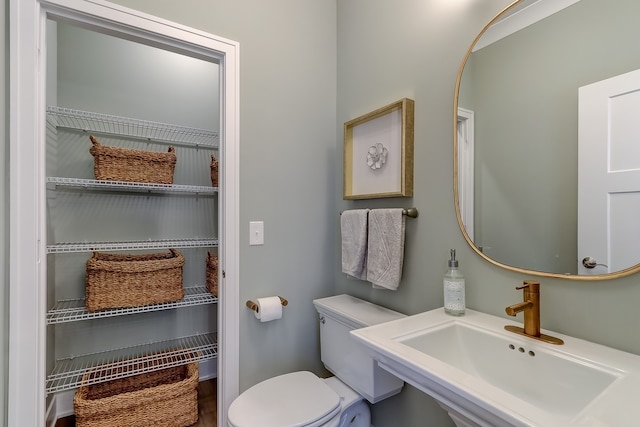 bathroom with sink and toilet