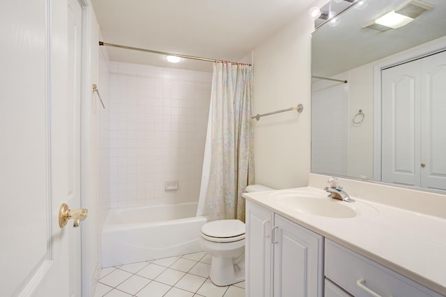 bathroom with visible vents, toilet, tile patterned floors, shower / bath combo with shower curtain, and vanity