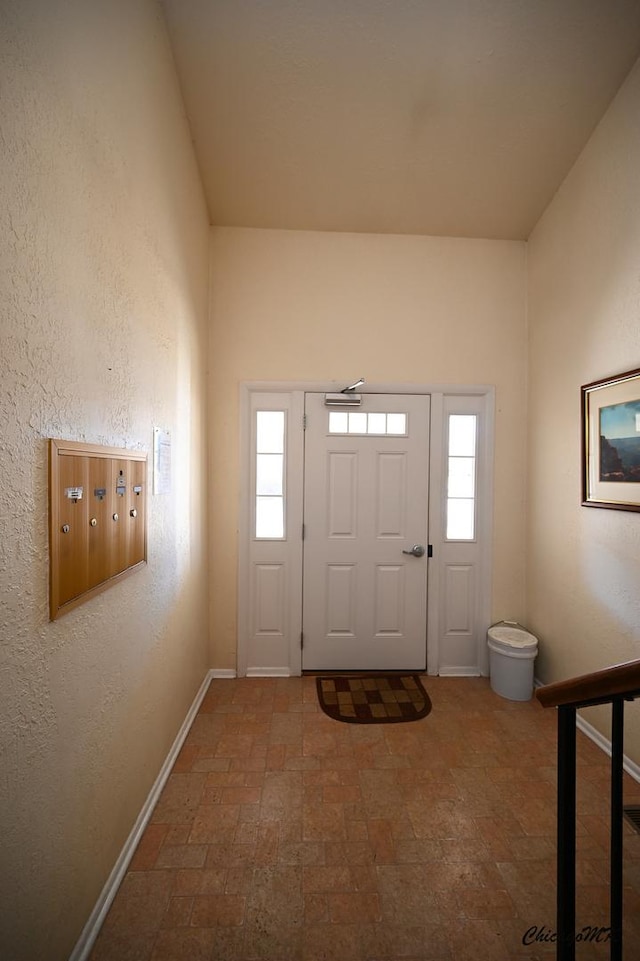 entrance foyer with plenty of natural light and mail boxes