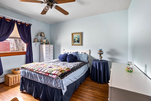 bedroom featuring dark hardwood / wood-style floors and ceiling fan