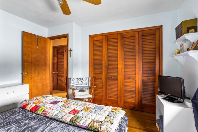 bedroom with wood-type flooring, a closet, and ceiling fan