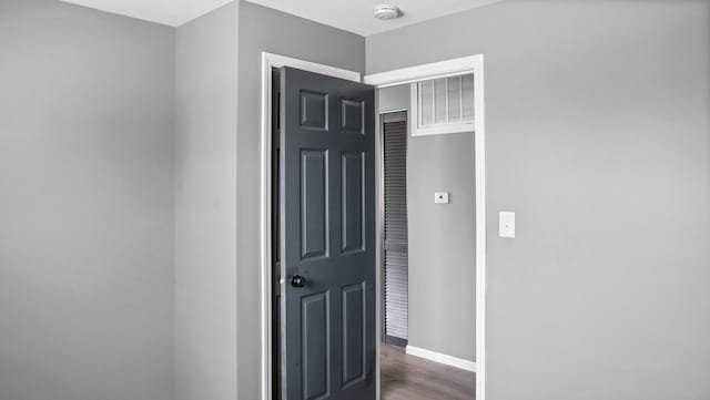 hallway featuring dark wood-type flooring