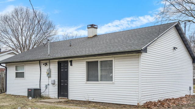 back of house featuring central AC unit