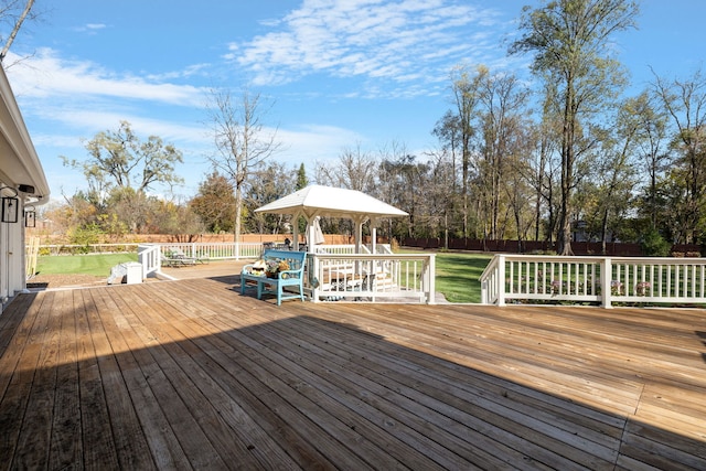 deck with a gazebo and a lawn