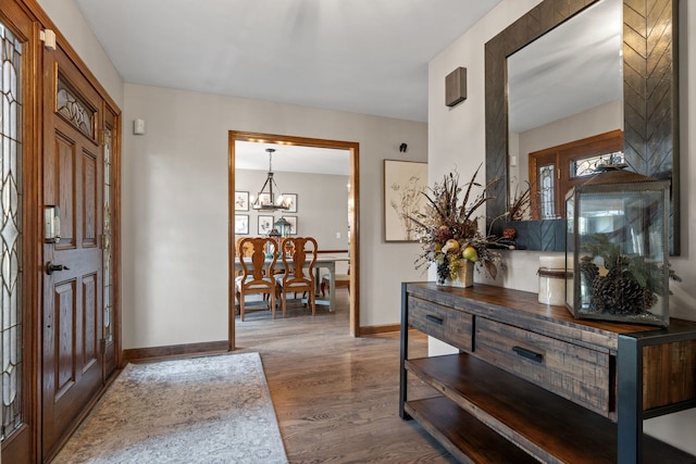 entrance foyer featuring a chandelier and hardwood / wood-style floors