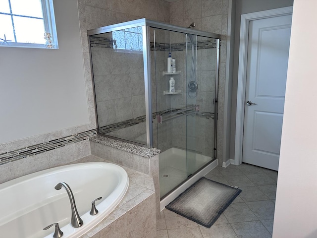 bathroom with plus walk in shower and tile patterned floors