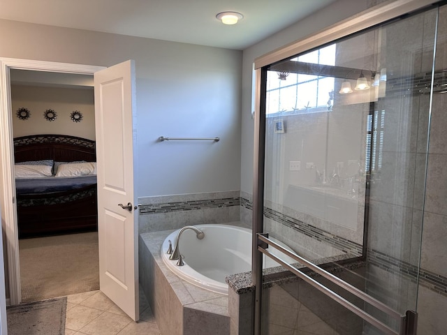 bathroom featuring tile patterned flooring and independent shower and bath