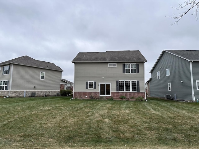 back of property featuring a yard and cooling unit