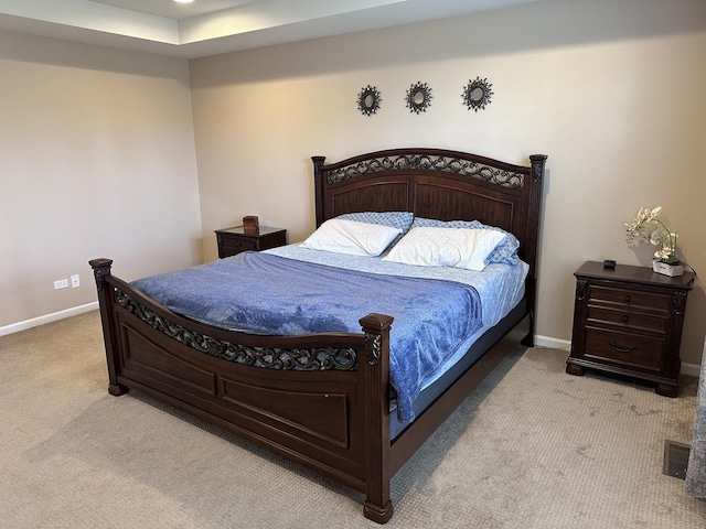 bedroom with light colored carpet