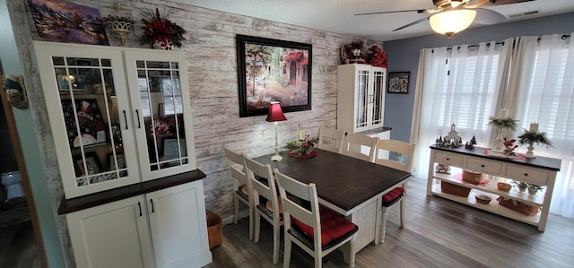 dining room with dark hardwood / wood-style floors and ceiling fan