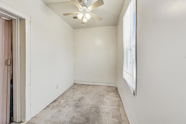 spare room featuring ceiling fan and light carpet