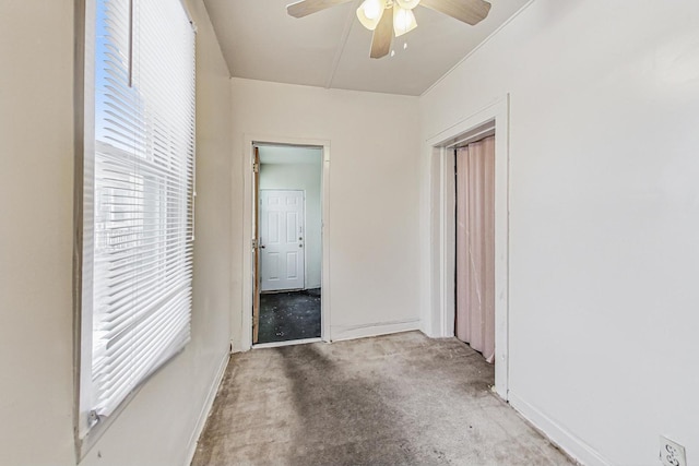 interior space with a healthy amount of sunlight and ceiling fan