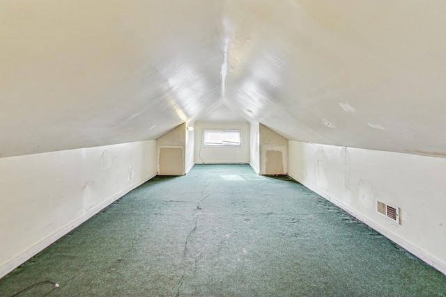 bonus room featuring lofted ceiling and carpet floors