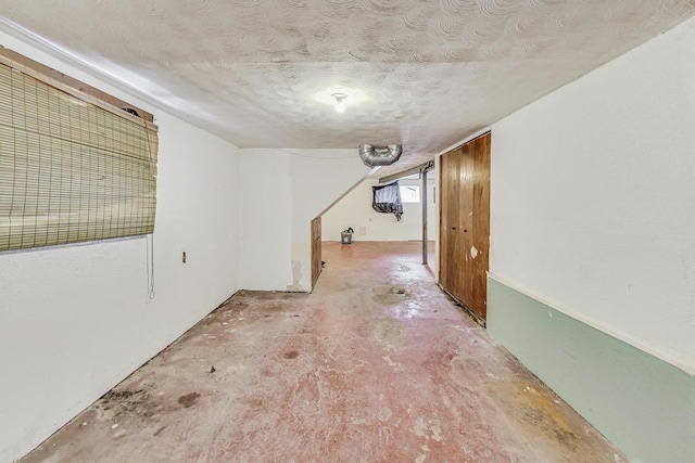 interior space featuring a textured ceiling