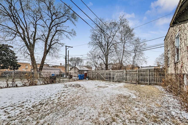 view of yard layered in snow