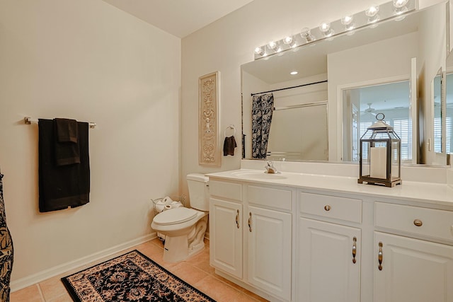 bathroom with tile patterned flooring, vanity, curtained shower, and toilet