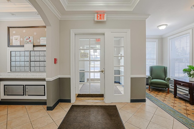 doorway to outside with crown molding and light tile patterned flooring