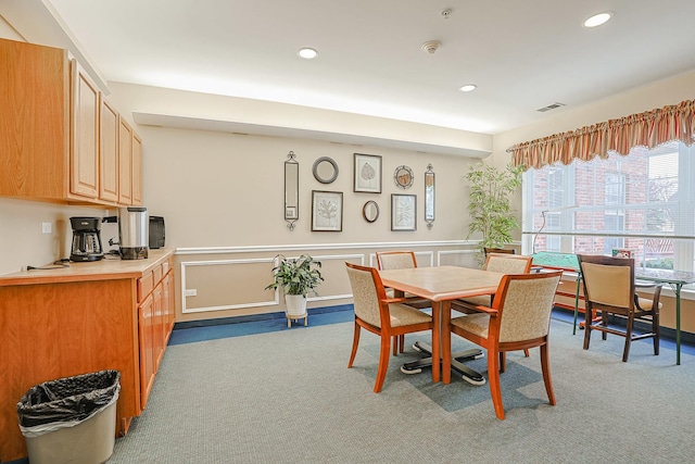 dining room with light carpet