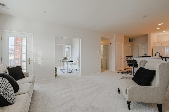 living room with light colored carpet