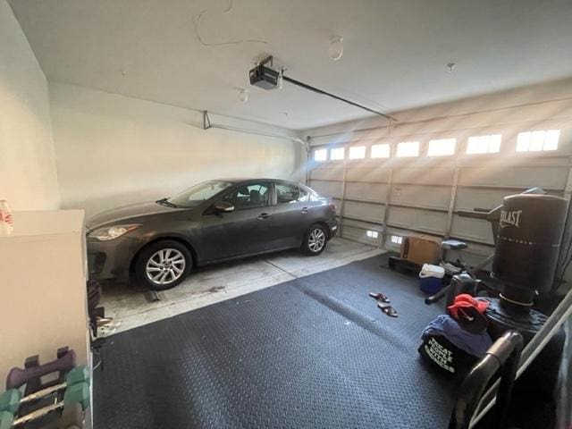 garage featuring a garage door opener