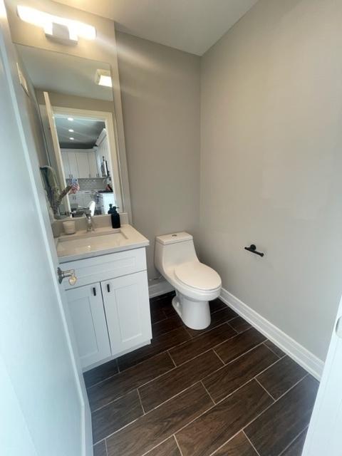 bathroom with vanity and toilet