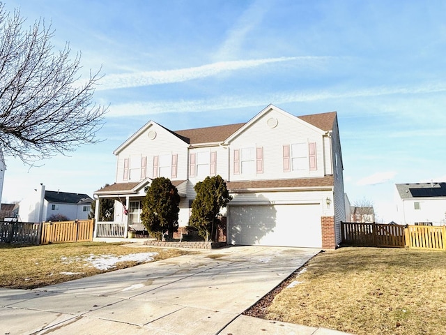 view of front property with a garage, a front yard, and a porch