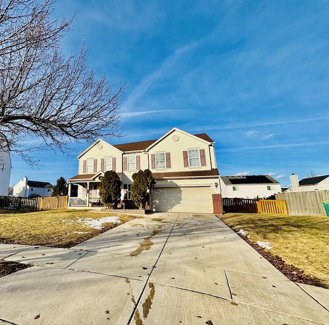 view of front of home with a garage, covered porch, and a front yard