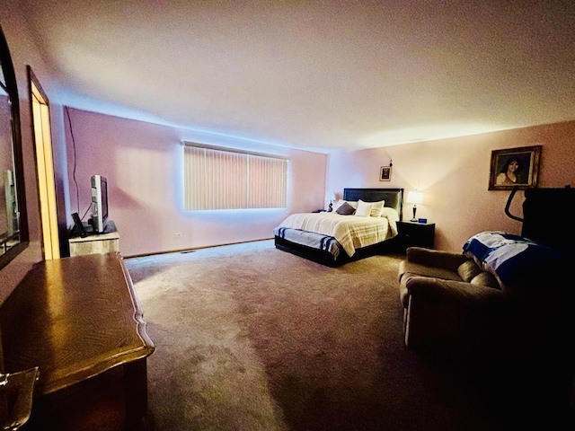 carpeted bedroom with a textured ceiling