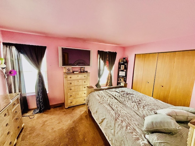 bedroom featuring carpet and a closet