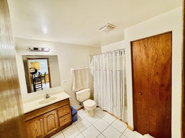 bathroom with vanity, curtained shower, tile patterned floors, and toilet