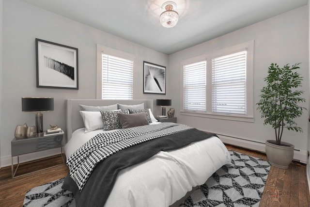 bedroom featuring dark hardwood / wood-style floors and baseboard heating