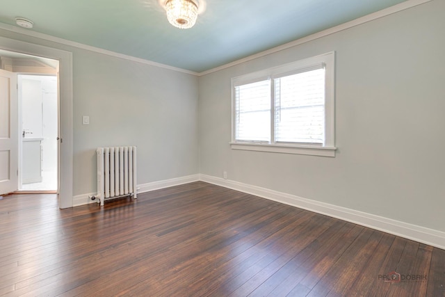 empty room with radiator, crown molding, and dark wood-type flooring