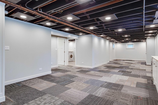 basement with washer / clothes dryer and carpet floors