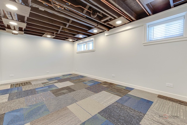 basement featuring carpet flooring